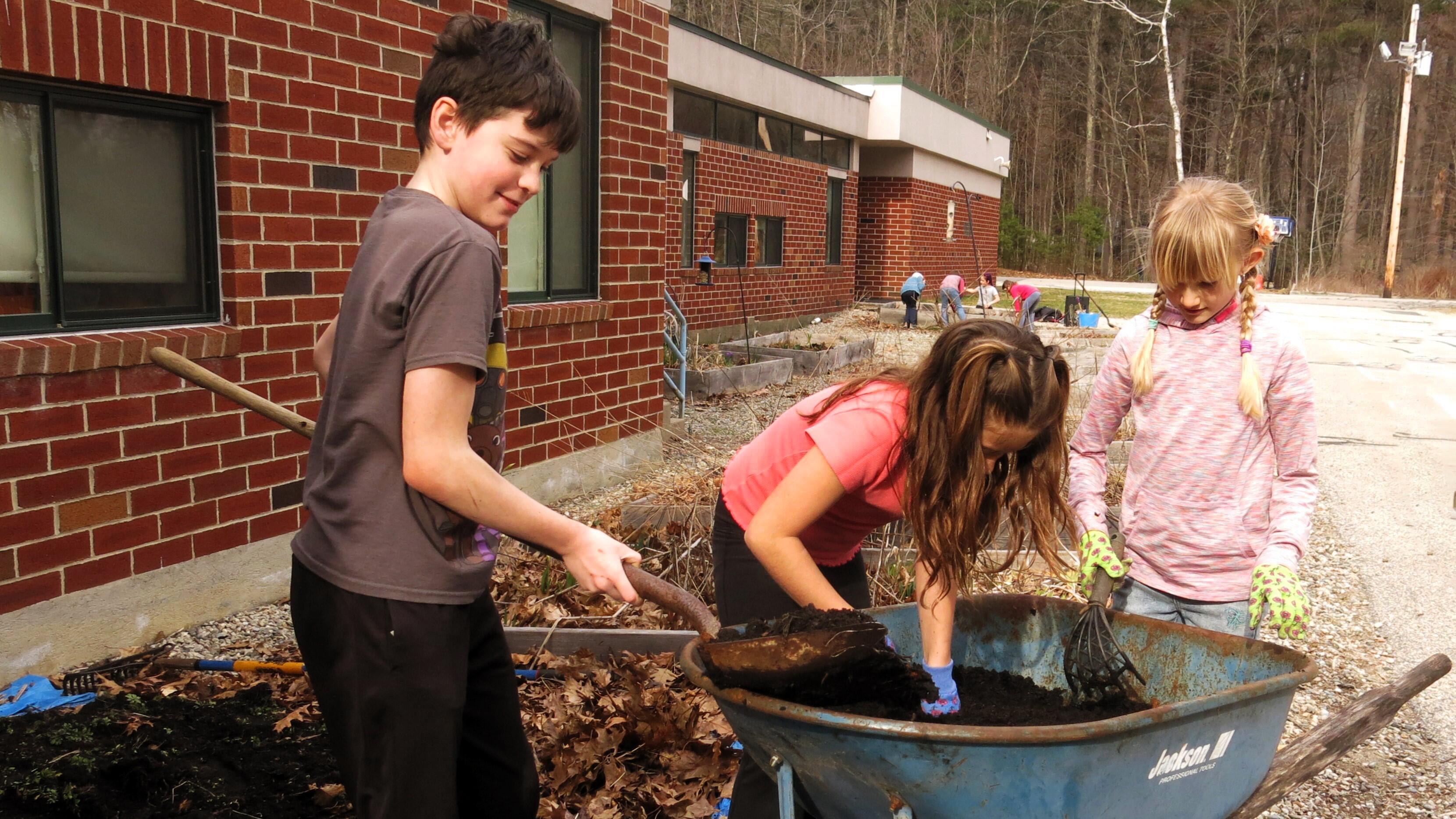 Sustainability Club students prepare the gardens for spring planting.
